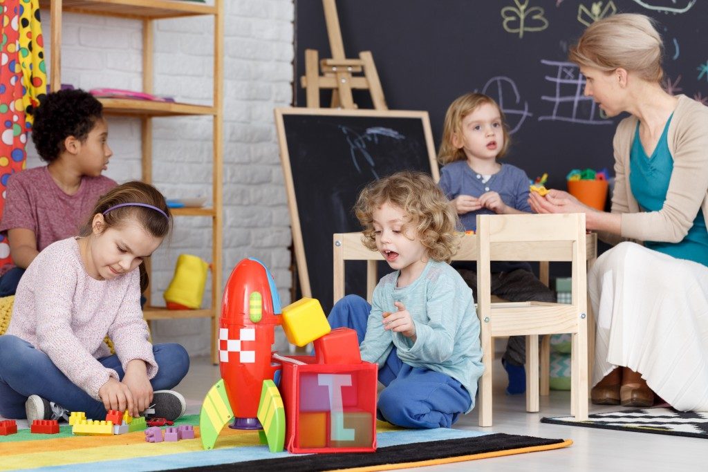 preschool classroom with kids playing