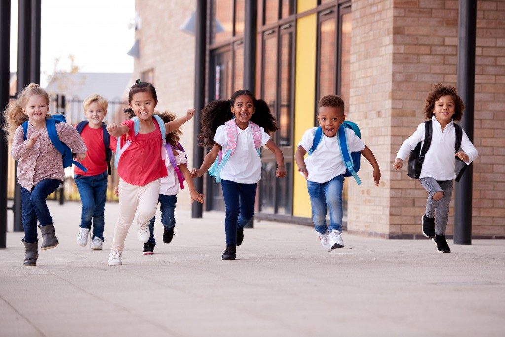 children running at the school corridor
