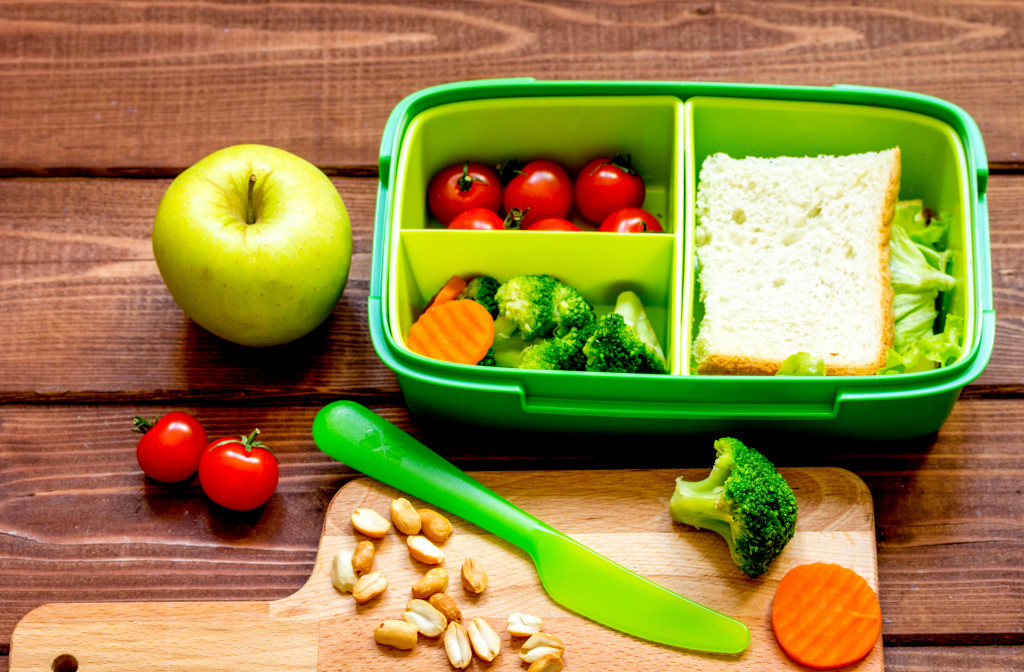 A lunch box filled with healthy vegetables and bread