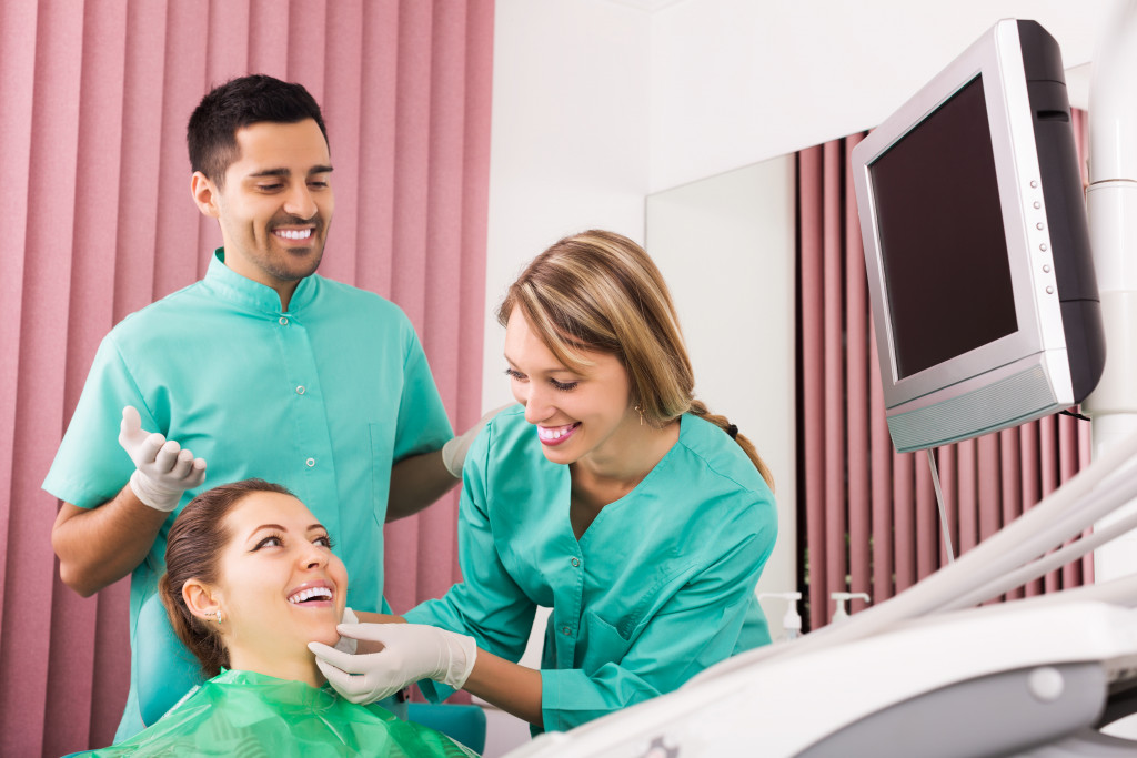 a teenager at a dentist office getting dental treatment
